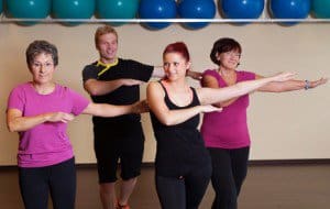 Seniors exercising with dance movements