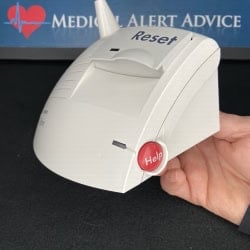 Hand Holding Lifeline Systems Medical Alert Console